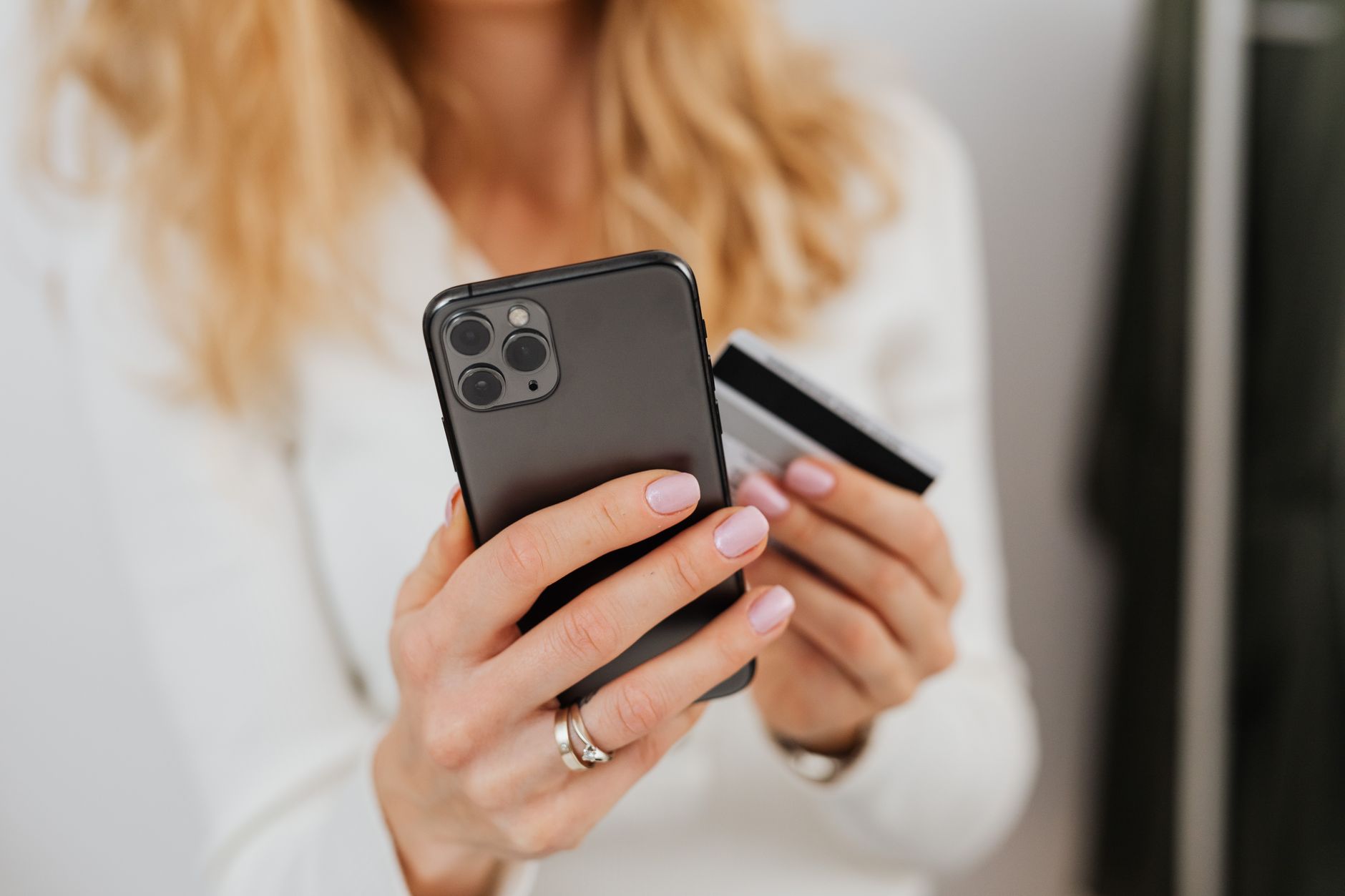 Person using a finance app on their smartphone to buy crypto