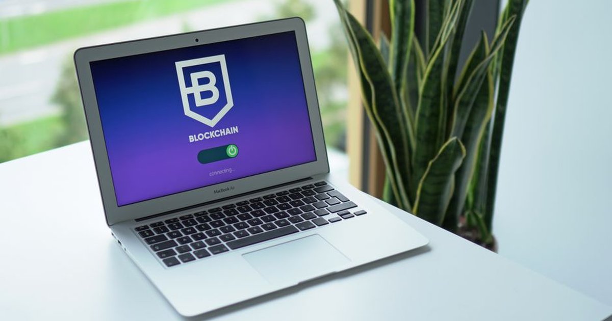 A modern laptop on a desk showing a blockchain interface, ideal for cryptocurrency topics.