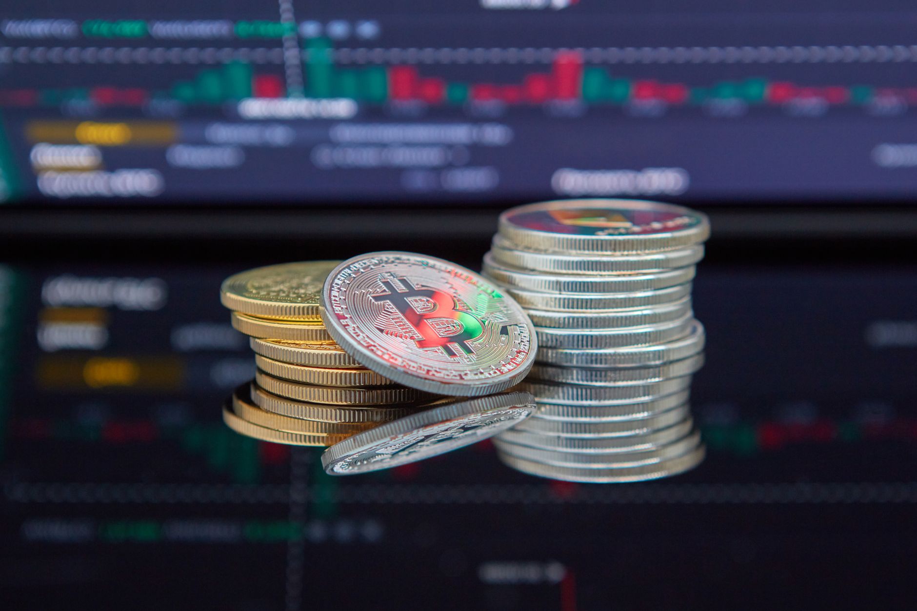 Ethereum coins with a reflective surface and vibrant gradient background, representing cryptocurrency and blockchain technology.