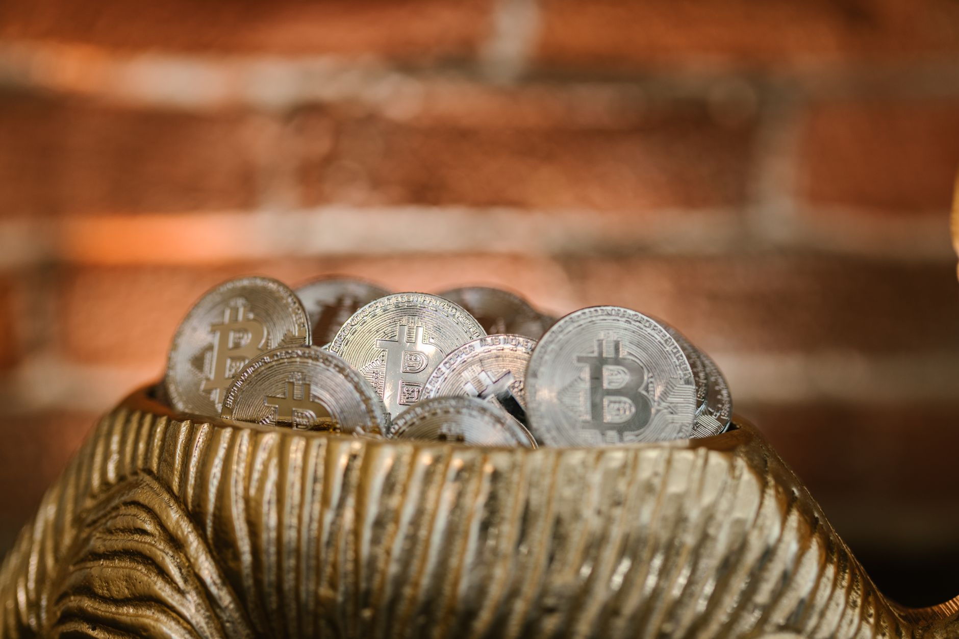 A hardware wallet device connected to a laptop for secure crypto storage