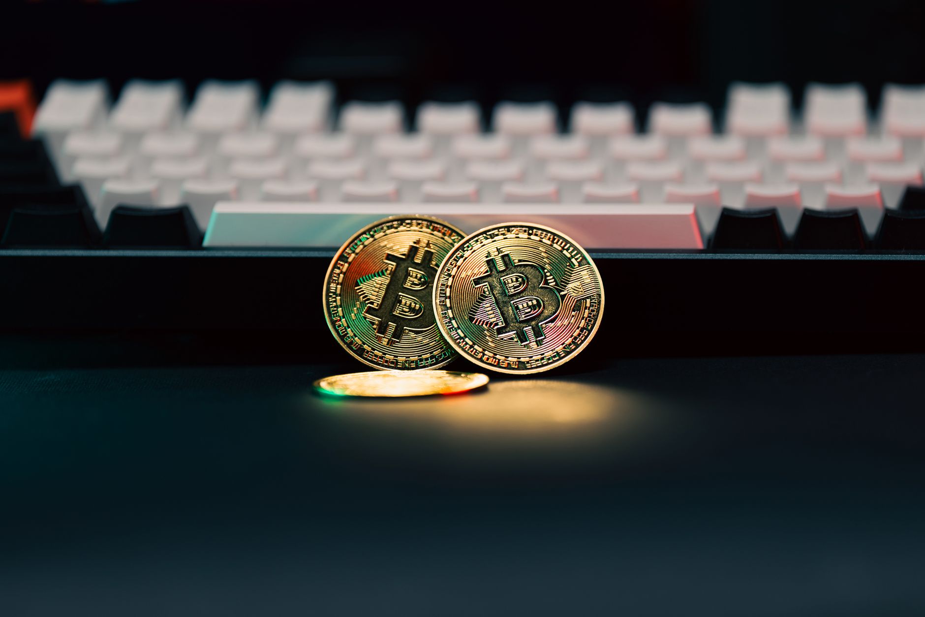 Close-up black and white image of a Dogecoin cryptocurrency coin with engraved text.