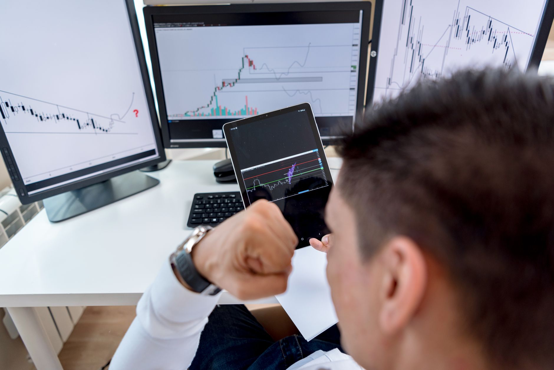 Trader looking at crypto charts with a frustrated expression