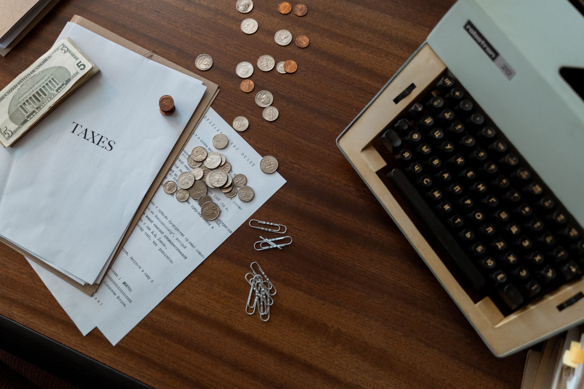 Bitcoin coins next to tax documents representing tax strategies