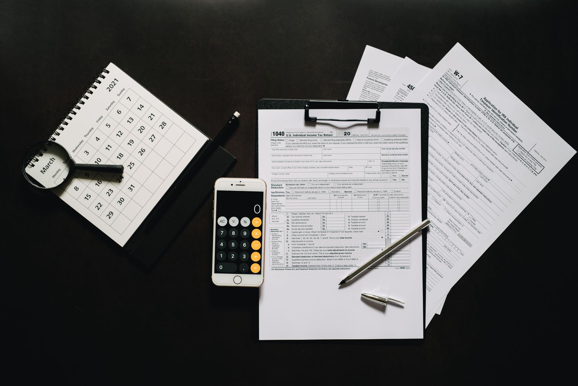 Canadian tax forms and a calculator on a desk