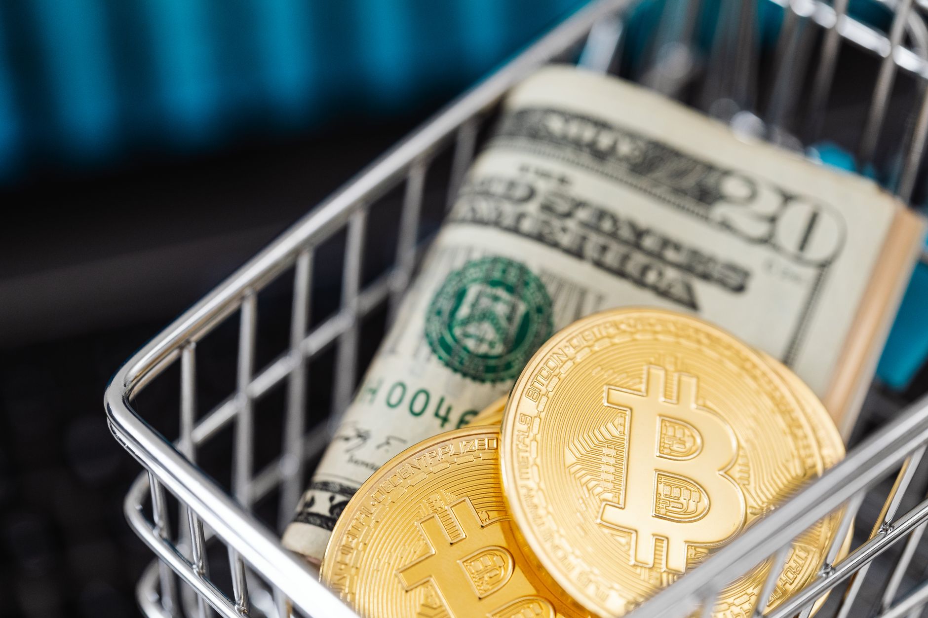 Close-up of golden Bitcoin coins with a red background, symbolizing digital currency and blockchain technology.
