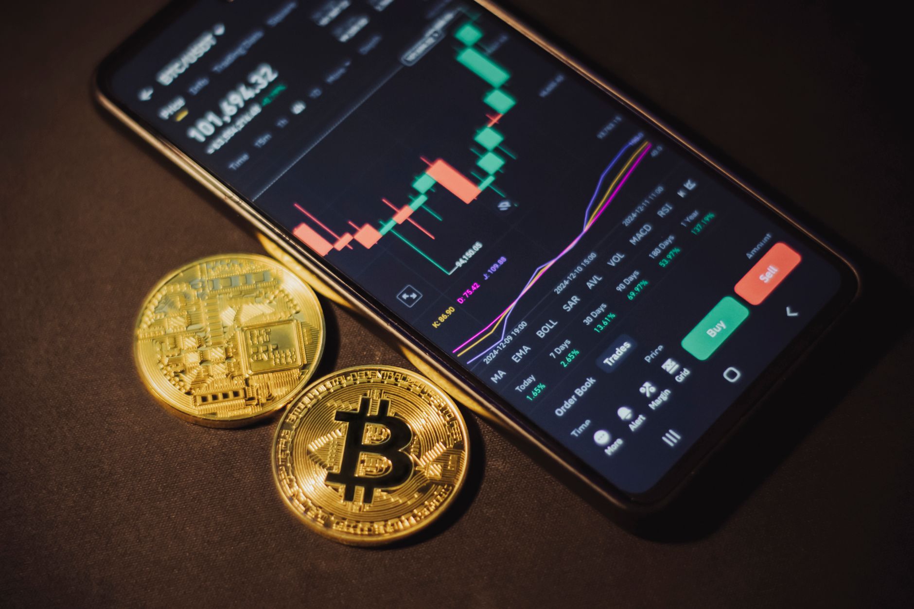 Close-up of golden Bitcoin coins on a shimmering glitter background, symbolizing digital currency's allure.