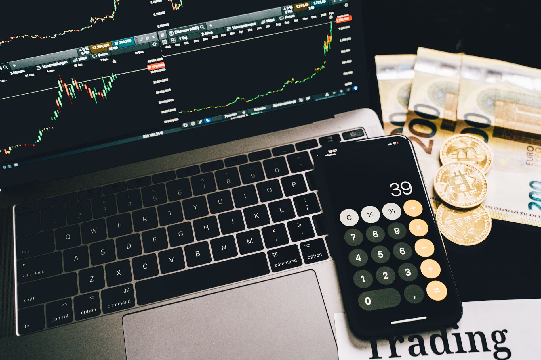 Laptop screen showing a bitcoin exchange platform with price charts