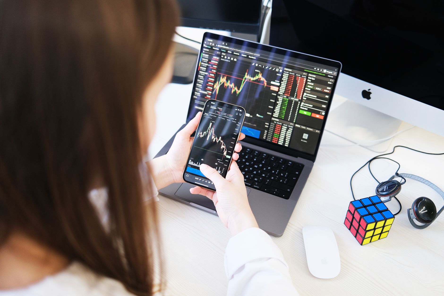 Comparison of crypto exchange interfaces on a laptop screen