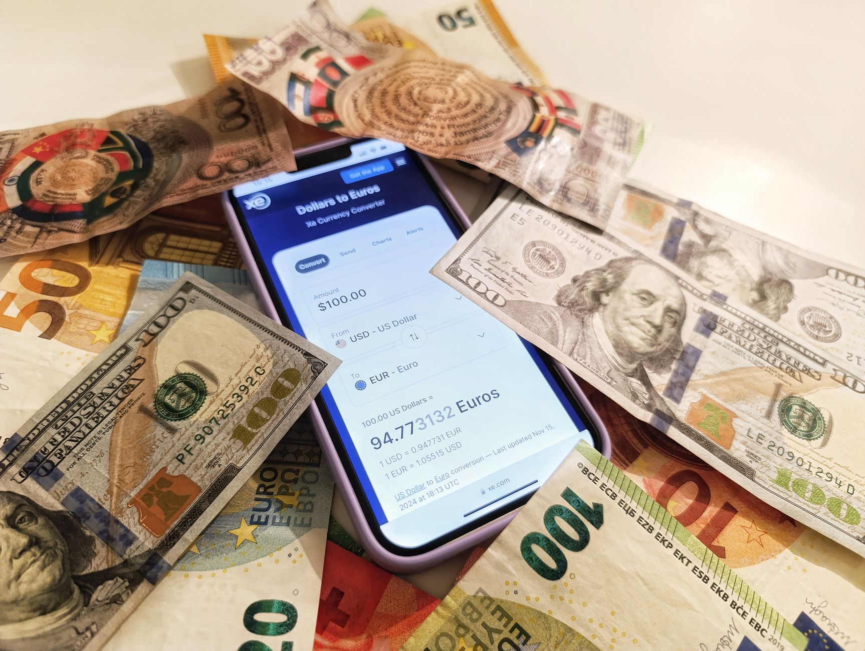 Person holding a smartphone with a payment confirmation screen showing a USDC transfer