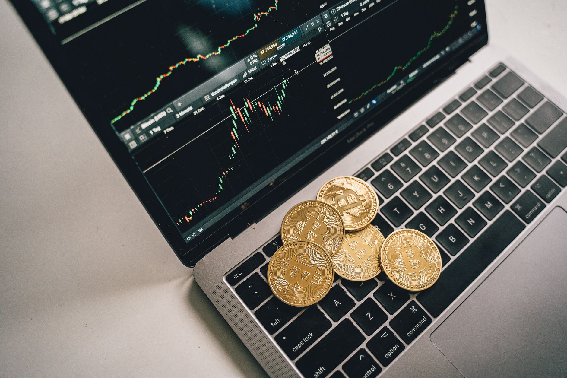 Laptop displaying a cryptocurrency lending dashboard with APY rates