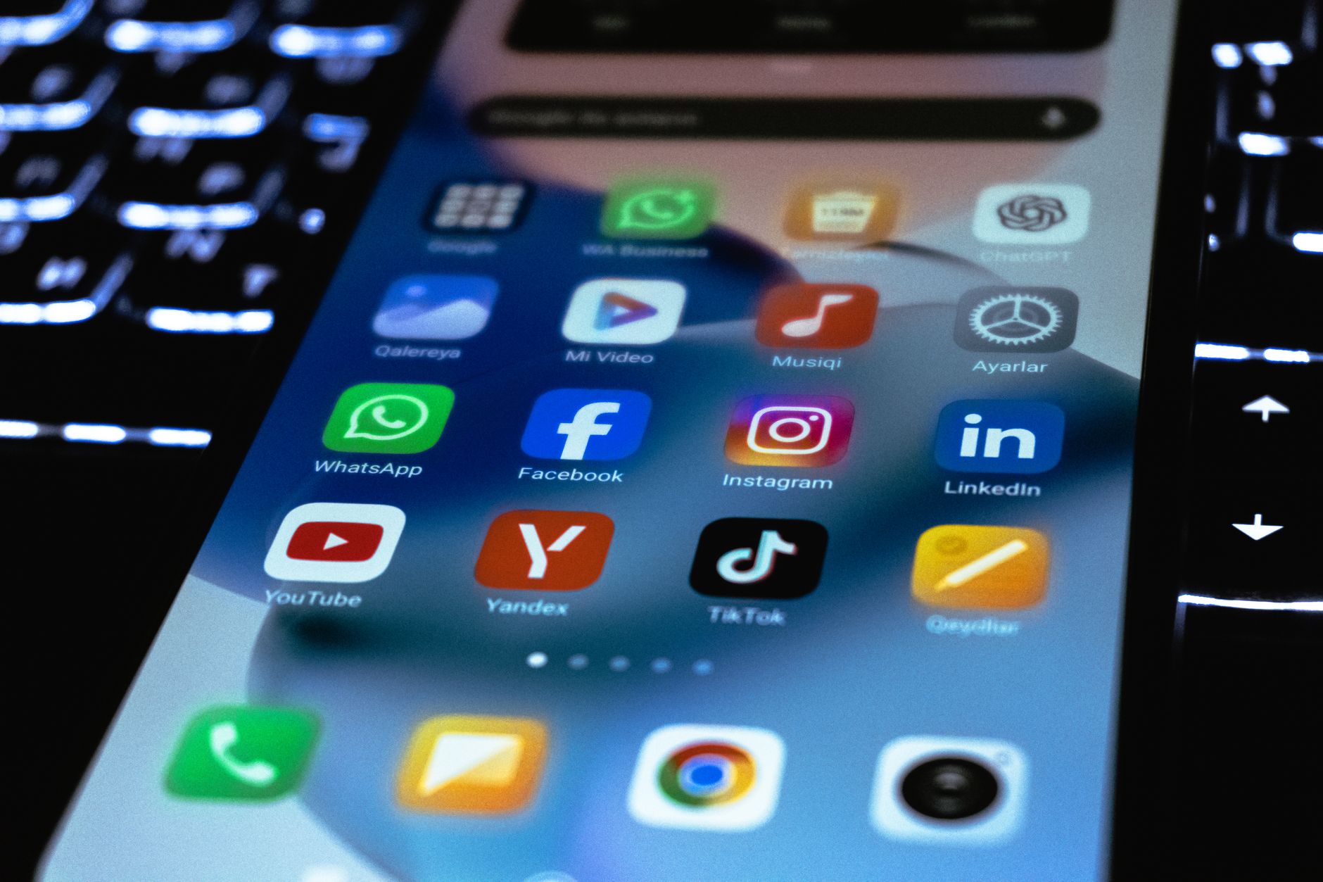 Smartphone showing social media feeds with trending crypto hashtags